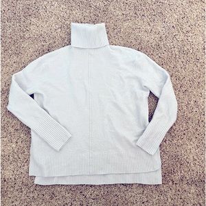 Light blue Athleta sweater with slit on the sides